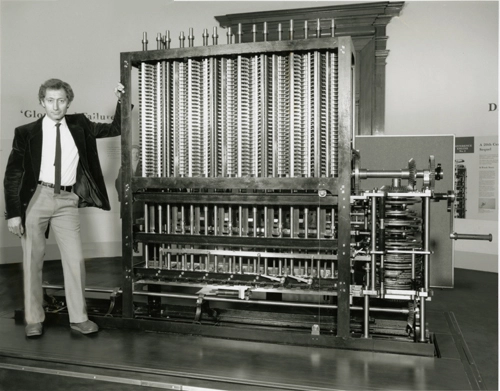 Charles Babbage in front of his Calculating Engine, the first programmable machine.
https://www.computerhistory.org/collections/catalog/102645777